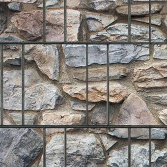Motiv Gitterzaun Steinmauer Bretagne
